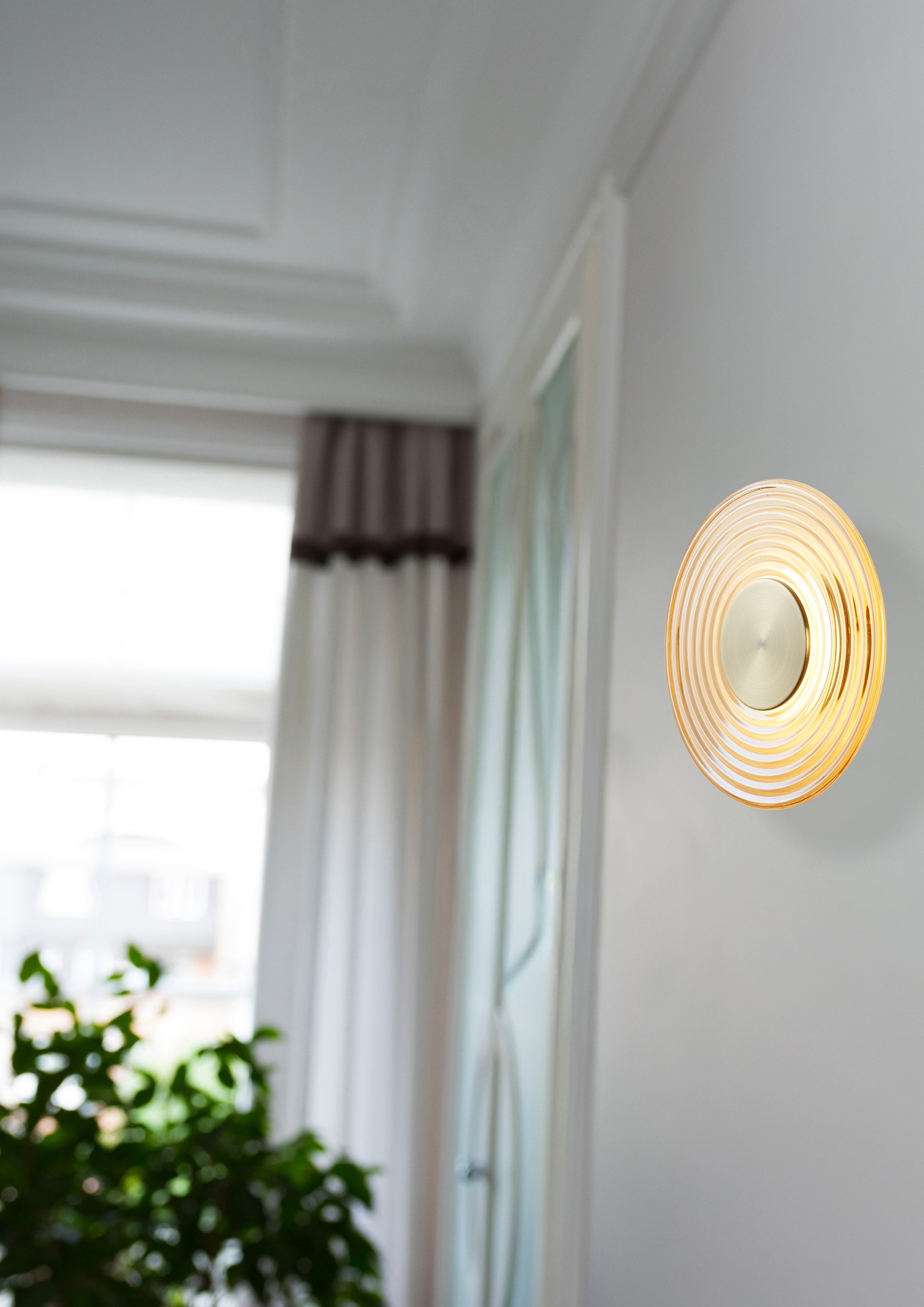 Cleo LED Wall Light, Antique Brass Metal with Amber Glass