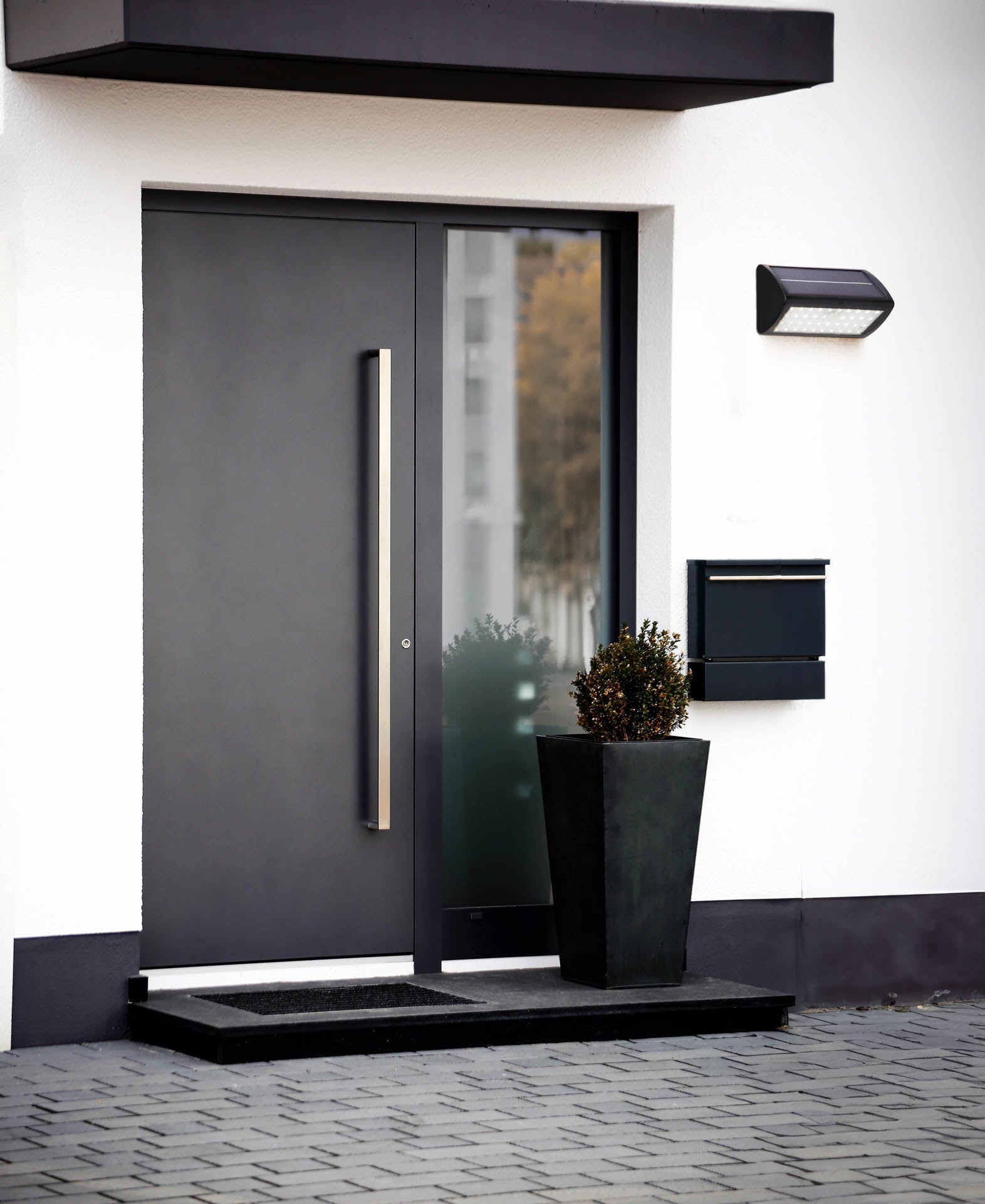 Solar Outdoor Wall Light - Black Metal & White Polycarbonate